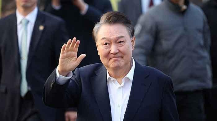 South Korea’s President Yoon free, trials continue after court quashes detention