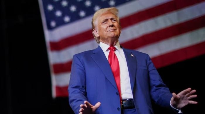 Trump pushes presidential limits in first 100 days