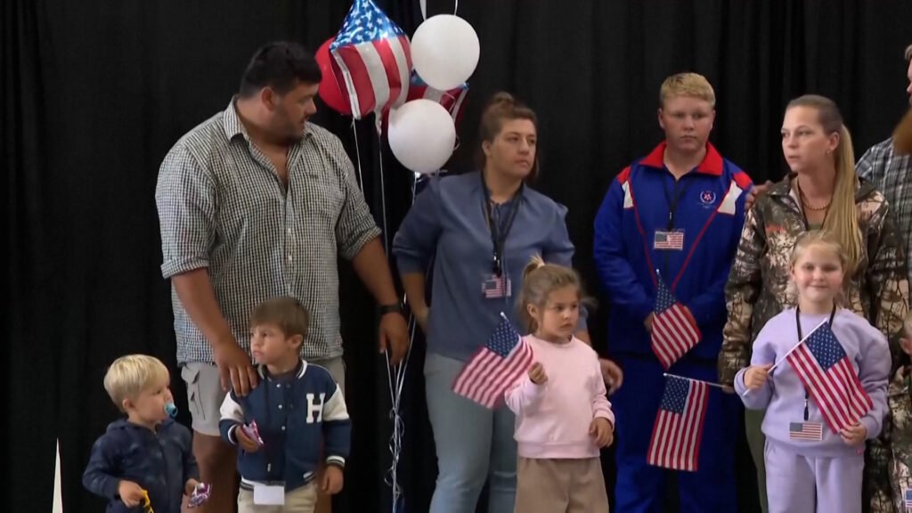 Dozens of white South Africans welcomed to US as refugees | Donald Trump