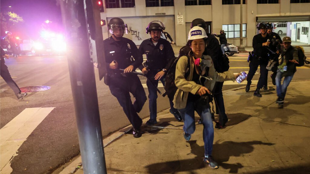 ‘Mass arrests’ in Los Angeles as protesters defy curfew