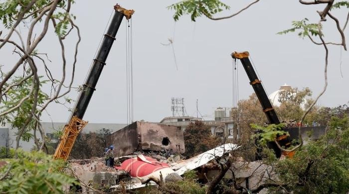 US officials survey Air India crash site, families continue to wait for bodies
