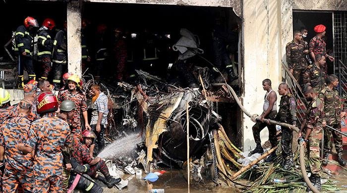 At least 19 killed as Bangladesh air force plane crashes into college campus