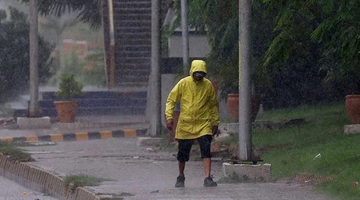 Karachi wakes up to scattered light showers, dark skies hint at heavier spell ahead