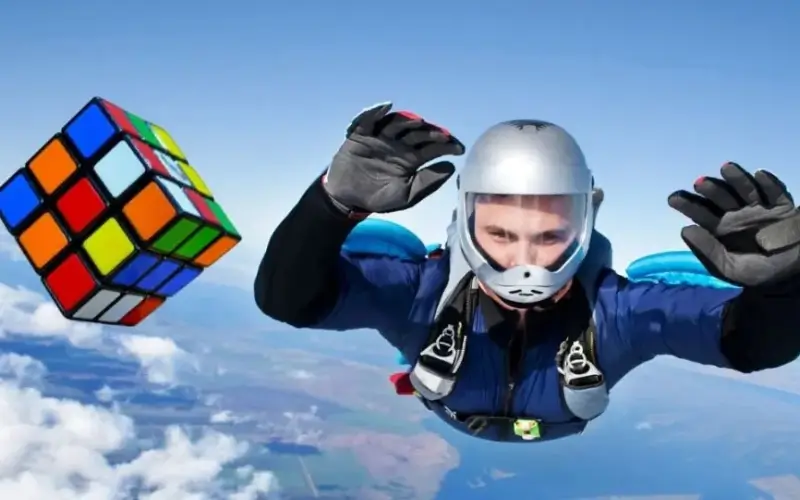 Man solves two Rubik’s cubes while skydiving to break world record