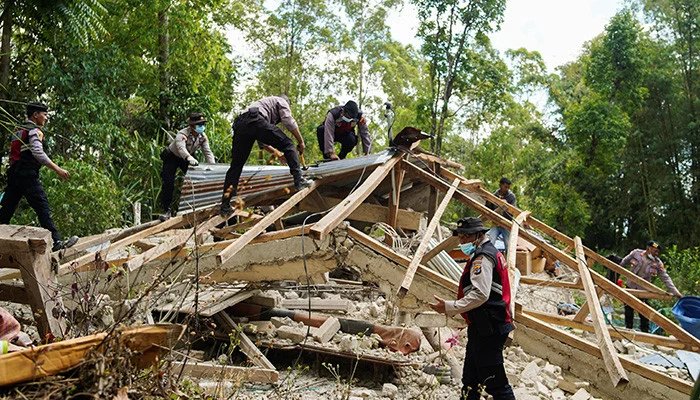 Thousands evacuate after Indonesia quake kills more than 50, cuts roads