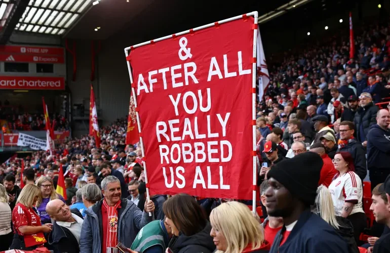 Which banners did Liverpool fans display at Anfield against Man City?