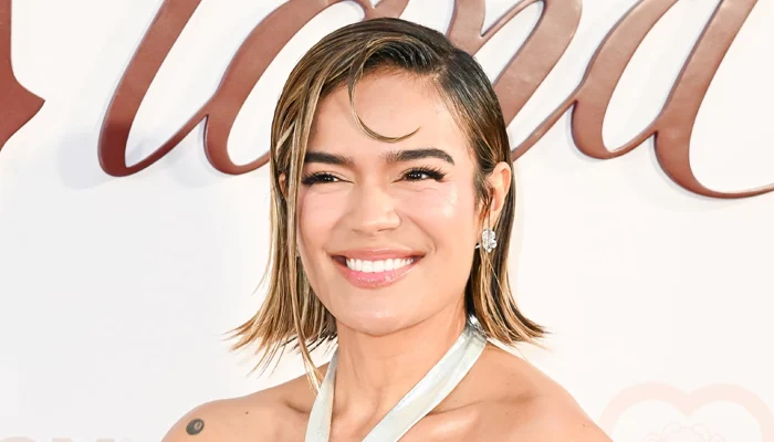 Karol G details how ‘losing so much weight’ is affecting her muscles