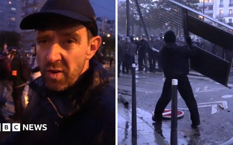 Fireworks and tear gas as protesters and riot police clash in Paris