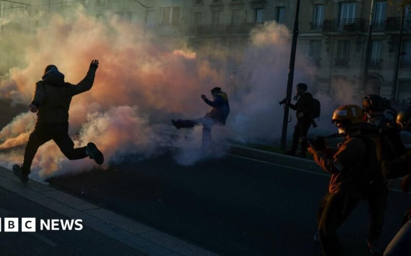 Clashes erupt between police and protesters in Paris