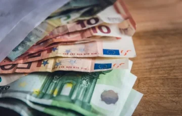 Euro plunges to 17-month low as France debt and Spain election fuel uncertainty